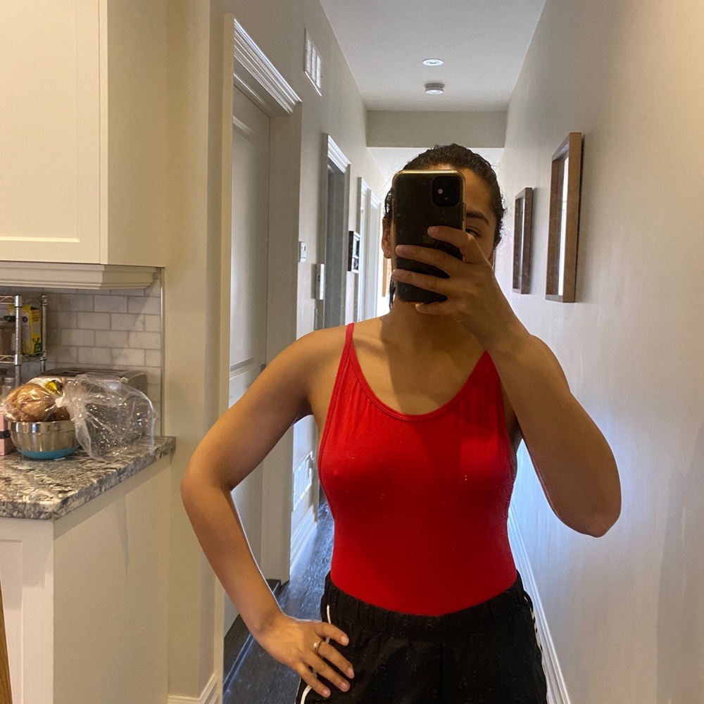 TNA red body suit.